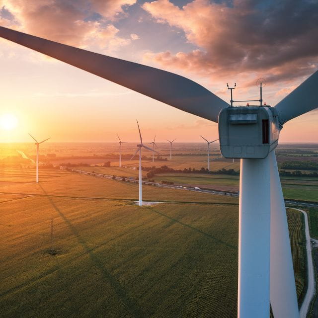 wind turbines with a sunset