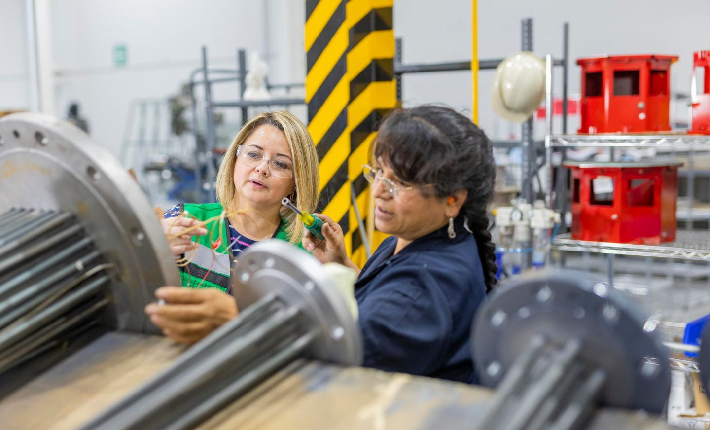 Two workers at a Chromalox facility