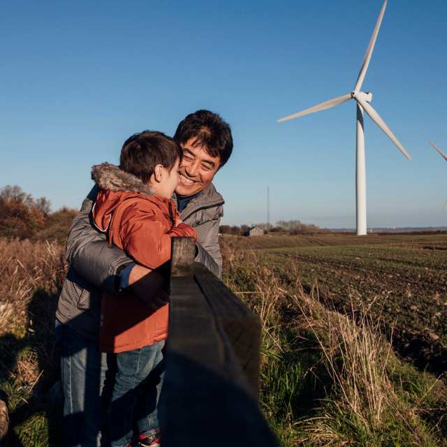 A father and son looking out into a field