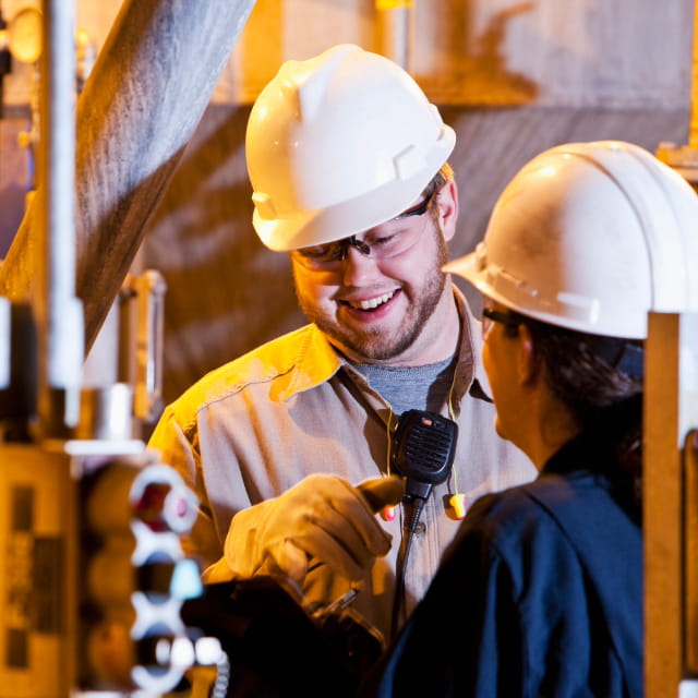 Engineers talking to each other on site