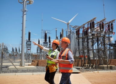 Engineers on site near electrical unit