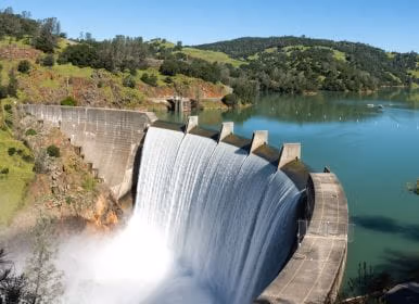 picture of a dam with water running down it