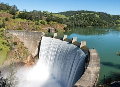 picture of a dam with water running down it