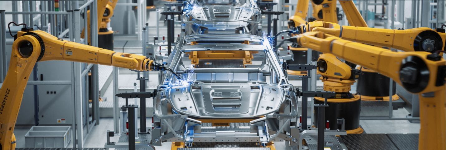 electric cars in manufacturing line