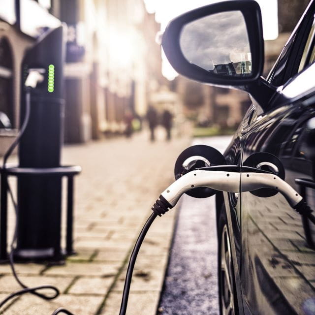 Electric car being charged