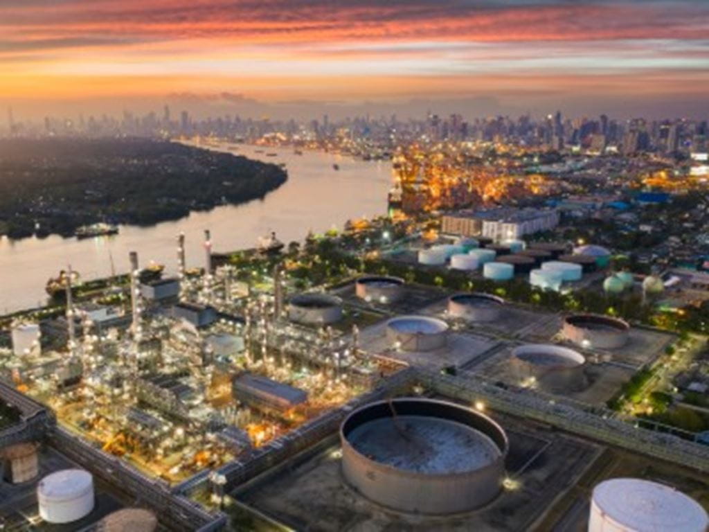 Aerial view of oil refinery near city