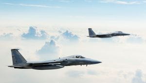 two planes flying within the clouds