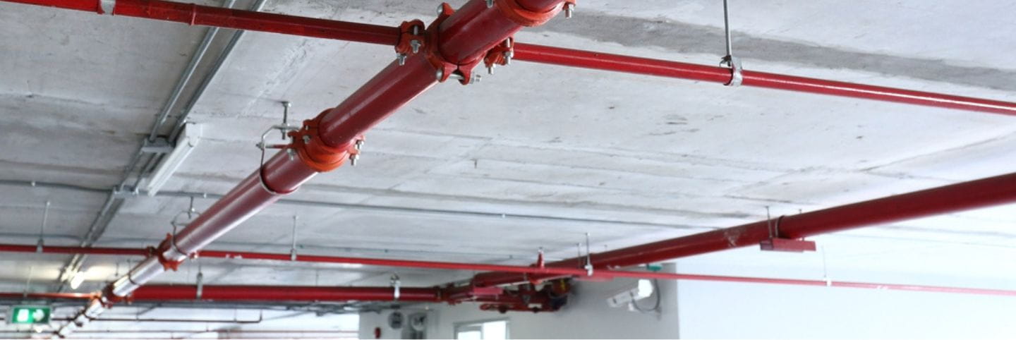 picture of red piping on the ceiling