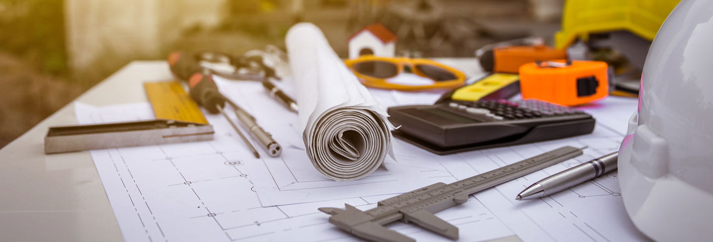 Tools lying on plans on a table